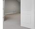 Bedroom featuring neutral paint and carpet, and access to a walk-in closet at 5029 Hartwell Ct, St Cloud, FL 34771