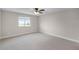 Bright bedroom featuring a ceiling fan and a window with natural light at 5029 Hartwell Ct, St Cloud, FL 34771