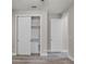 Bedroom features wood-look tile flooring and closet with shelving at 5029 Hartwell Ct, St Cloud, FL 34771