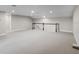 Spacious bonus room with carpet, neutral paint, and staircase at 5029 Hartwell Ct, St Cloud, FL 34771