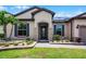 Charming single-story home with a manicured lawn and beautiful landscaping at 5029 Hartwell Ct, St Cloud, FL 34771