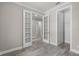 Neutral interior with a view of french doors and wood-look tile at 5029 Hartwell Ct, St Cloud, FL 34771