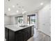 Bright kitchen with granite counters, stainless appliances, and large sliding doors to the outside at 5029 Hartwell Ct, St Cloud, FL 34771