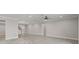 Open living space with wood-look tile flooring and light walls at 5029 Hartwell Ct, St Cloud, FL 34771