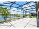 Enclosed patio featuring beautiful lake views and ample space for outdoor lounging at 5029 Hartwell Ct, St Cloud, FL 34771