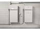 Image displays two Tesla Powerwall units installed on a wall, showcasing home energy storage capabilities at 5029 Hartwell Ct, St Cloud, FL 34771