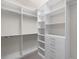 Spacious walk-in closet with custom shelving and ample storage space at 5029 Hartwell Ct, St Cloud, FL 34771