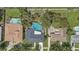 Aerial view of a home with a screened-in pool and spacious backyard, surrounded by mature trees at 5882 Marlberry Dr, Orlando, FL 32819