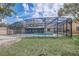 Sprawling backyard featuring an enclosed pool area, perfect for private outdoor relaxation and entertainment at 5882 Marlberry Dr, Orlando, FL 32819