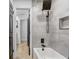 Updated bathroom with modern shower head, gray tile, and built-in niche at 5882 Marlberry Dr, Orlando, FL 32819