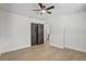 Empty bedroom showcasing clean white walls, fresh wood flooring and an overhead ceiling fan at 5882 Marlberry Dr, Orlando, FL 32819