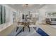 Bright dining room featuring a stylish table, chairs, and contemporary lighting fixture at 5882 Marlberry Dr, Orlando, FL 32819