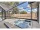 Outdoor hot tub in a screened enclosure offers privacy and relaxation with a view of the fenced yard at 5882 Marlberry Dr, Orlando, FL 32819
