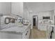 Bright kitchen featuring marble countertops and backsplash with stainless steel appliances at 5882 Marlberry Dr, Orlando, FL 32819