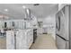 Open kitchen featuring stainless appliances, marble countertops, and a spacious island at 5882 Marlberry Dr, Orlando, FL 32819