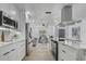 Bright, updated kitchen featuring marble countertops, stainless steel appliances, and modern cabinetry at 5882 Marlberry Dr, Orlando, FL 32819