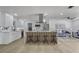 Renovated kitchen with marble countertops, modern island, and stainless steel appliances at 5882 Marlberry Dr, Orlando, FL 32819