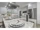 Gourmet kitchen with stainless appliances, marble countertops, and modern lighting at 5882 Marlberry Dr, Orlando, FL 32819
