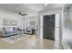 Bright living room with modern furniture, a ceiling fan, and a view of the front yard at 5882 Marlberry Dr, Orlando, FL 32819
