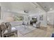 Bright and airy living room with modern furnishings and a large window overlooking the landscape at 5882 Marlberry Dr, Orlando, FL 32819