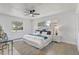 Bright primary bedroom featuring a plush bed, modern decor, and ample natural light at 5882 Marlberry Dr, Orlando, FL 32819