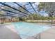 Bright screened-in pool with refreshing blue water and an expansive deck for entertaining and relaxing at 5882 Marlberry Dr, Orlando, FL 32819