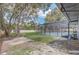 A spacious backyard features a screened in pool and patio that provides an oasis for relaxing and entertaining at 5882 Marlberry Dr, Orlando, FL 32819