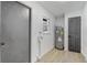 Spacious utility room with modern door and water heater at 5882 Marlberry Dr, Orlando, FL 32819