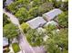 Aerial view of community townhomes surrounded by mature shade trees and lush landscaping at 641 Maple Oak Cir # 101, Altamonte Springs, FL 32701