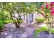 Back yard patio with mature shade trees and lush plants at 641 Maple Oak Cir # 101, Altamonte Springs, FL 32701