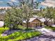 Overhead view of a charming home with lush landscaping and an inviting two-car garage at 641 Maple Oak Cir # 101, Altamonte Springs, FL 32701