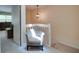 Hallway area featuring a gray accent chair and a staircase leading to the upper level at 641 Maple Oak Cir # 101, Altamonte Springs, FL 32701