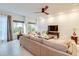 Sun-filled living room boasts large windows and comfortable seating at 641 Maple Oak Cir # 101, Altamonte Springs, FL 32701