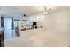 Open-concept living room with tile floors, large windows providing natural light and a ceiling fan at 641 Maple Oak Cir # 101, Altamonte Springs, FL 32701