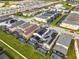 Neighborhood aerial view showcasing the property, community layout, and nearby amenities at 8913 Coconut Breeze Dr, Kissimmee, FL 34747