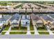 Front aerial view showcasing the property's facade, landscaping, and neighborhood setting at 8913 Coconut Breeze Dr, Kissimmee, FL 34747