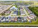 Aerial view of homes showcasing neighborhood layout and nearby natural areas at 8913 Coconut Breeze Dr, Kissimmee, FL 34747