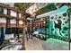 A whimsical bunkroom features a unique, double-stacked bunk bed and a playful dinosaur theme at 8913 Coconut Breeze Dr, Kissimmee, FL 34747