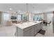 Bright, open concept kitchen with a spacious island, seamlessly connecting the living and dining areas for easy entertaining at 8913 Coconut Breeze Dr, Kissimmee, FL 34747