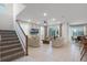 Open-concept living room featuring tile floors, modern furniture, a ceiling fan, and sliding glass doors to the patio at 8913 Coconut Breeze Dr, Kissimmee, FL 34747