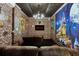 Movie room with brick walls, a ceiling with stars and a big movie screen to enjoy with friends and Gathering at 8913 Coconut Breeze Dr, Kissimmee, FL 34747