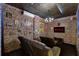 Movie room with brick walls, a ceiling with stars and a big movie screen to enjoy with friends and Gathering at 8913 Coconut Breeze Dr, Kissimmee, FL 34747