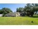 Expansive backyard featuring a screened-in patio, gazebo, and lush greenery offers plenty of space at 901 Candle Berry Rd, Orlando, FL 32825