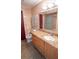 The bathroom has a granite vanity, a toilet, and a mirror at 901 Candle Berry Rd, Orlando, FL 32825