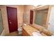 Bathroom featuring a granite vanity, toilet, and a framed mirror above at 901 Candle Berry Rd, Orlando, FL 32825