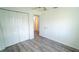 Bedroom featuring luxury vinyl plank flooring, neutral paint and closet at 901 Candle Berry Rd, Orlando, FL 32825