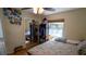 Cozy bedroom featuring a ceiling fan, window with blinds, and closet with mirrored doors at 901 Candle Berry Rd, Orlando, FL 32825