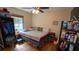Bedroom featuring wood floors, a window, and plenty of storage space at 901 Candle Berry Rd, Orlando, FL 32825