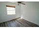 Bedroom features luxury vinyl plank flooring, natural light and a ceiling fan at 901 Candle Berry Rd, Orlando, FL 32825
