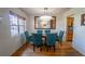 Elegant dining room with a chandelier, large mirror, and seating for six at 901 Candle Berry Rd, Orlando, FL 32825